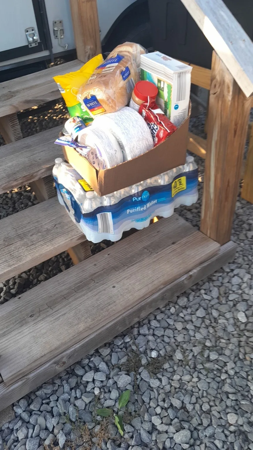 Food and bottled water placed inside a Blessing Box